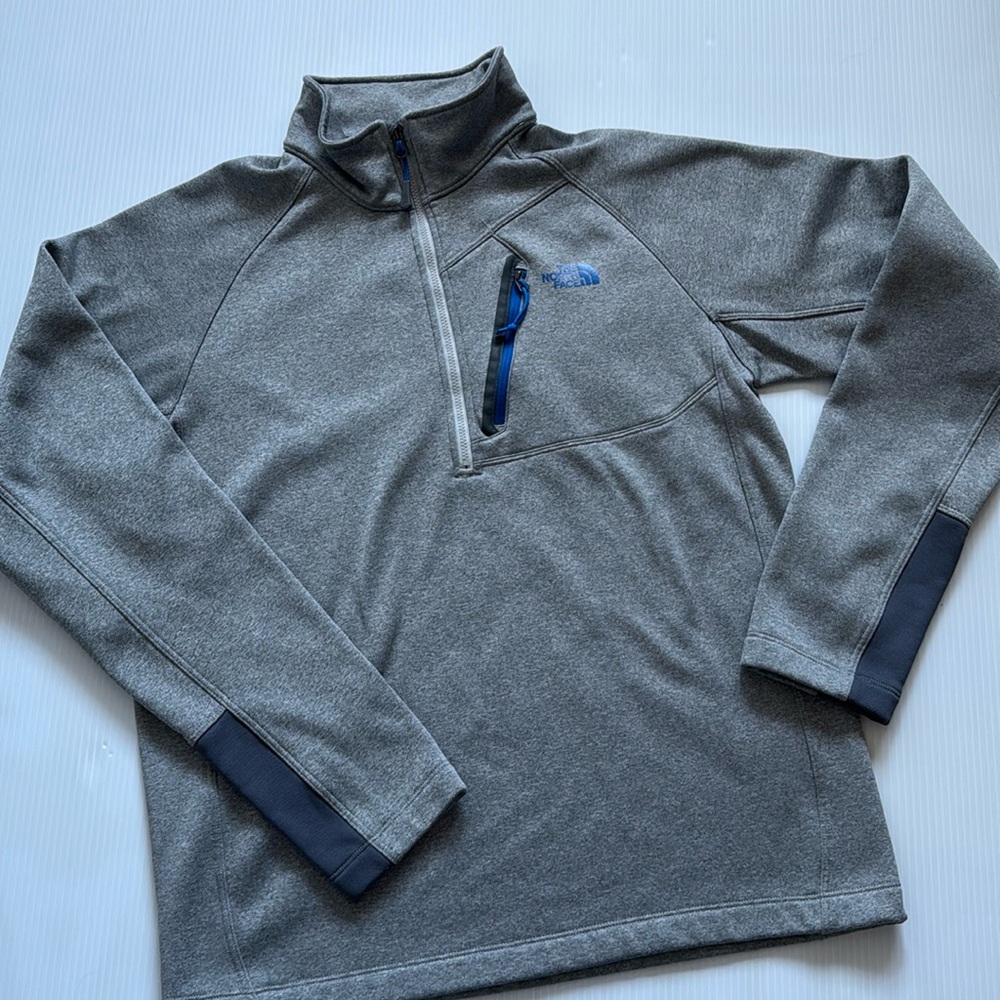 The North Face Men’s gray quarter zip with blue details.  Size medium
